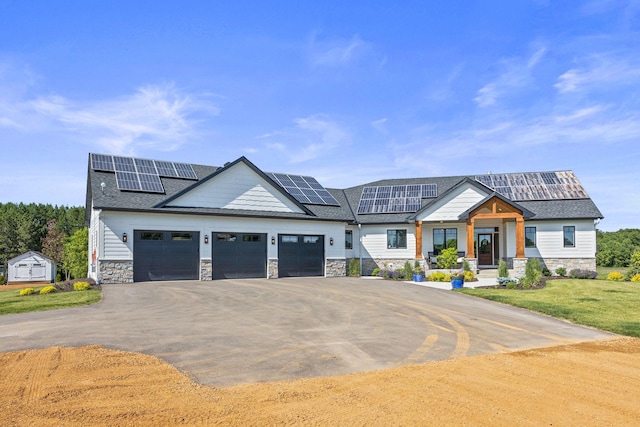 view of front of house with solar panels and a garage