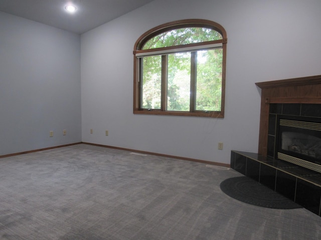 carpeted living room featuring a fireplace