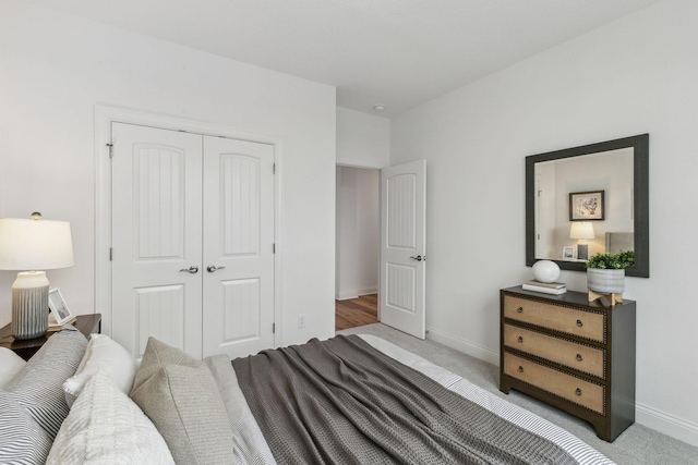 carpeted bedroom with a closet