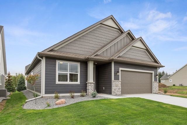 craftsman-style house featuring a garage and a front yard