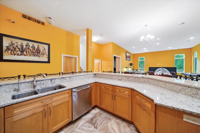 kitchen featuring light tile patterned flooring, sink, dishwasher, and light stone counters