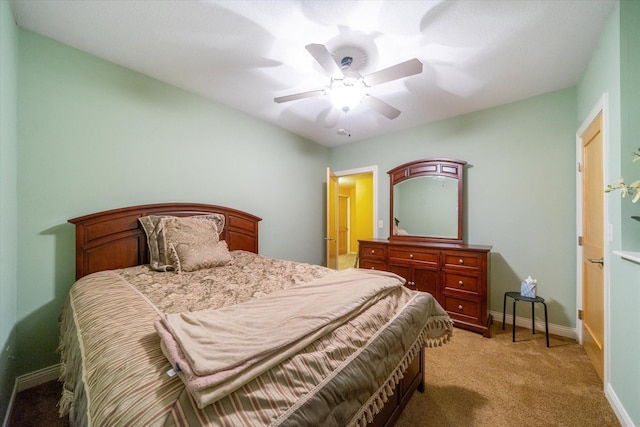 bedroom featuring ceiling fan and light carpet