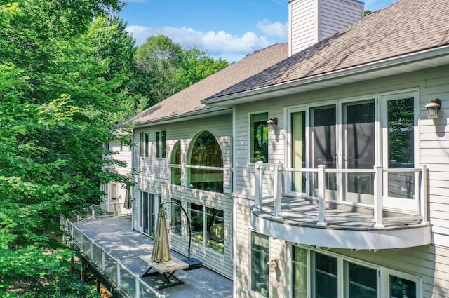 view of home's exterior with a balcony