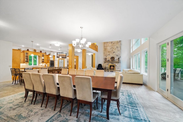 tiled dining area with an inviting chandelier