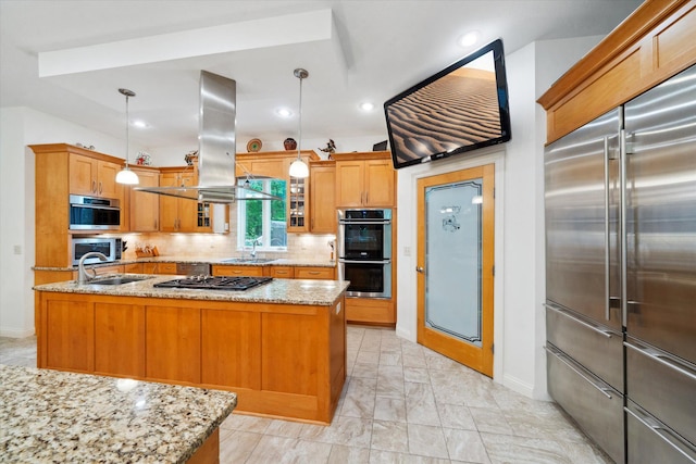 kitchen with light stone counters, stainless steel appliances, a center island, backsplash, and island range hood