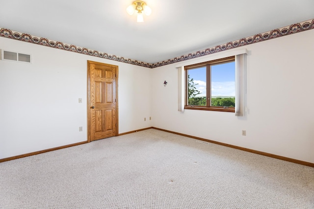 unfurnished room featuring carpet floors