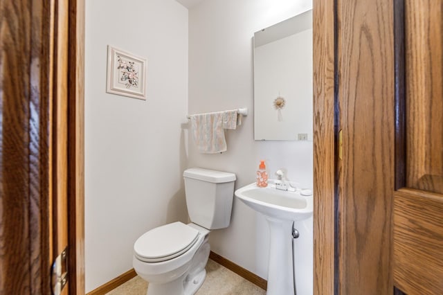 bathroom featuring toilet