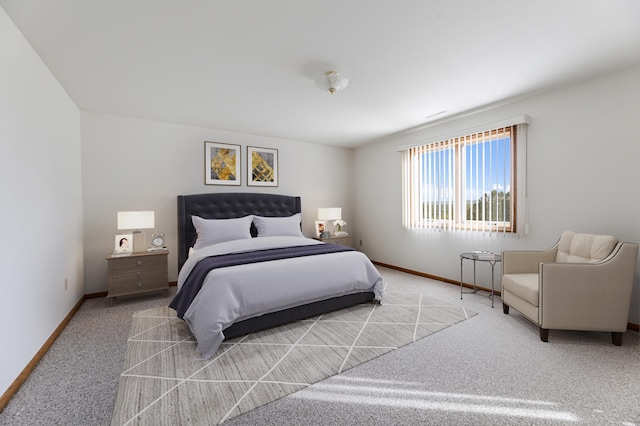 bedroom featuring light colored carpet