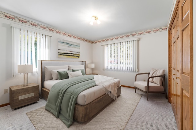 carpeted bedroom featuring a closet