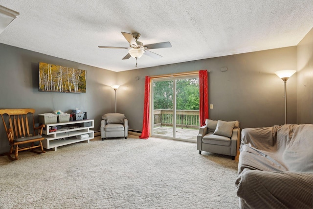 carpeted living room with a baseboard heating unit, a textured ceiling, and ceiling fan