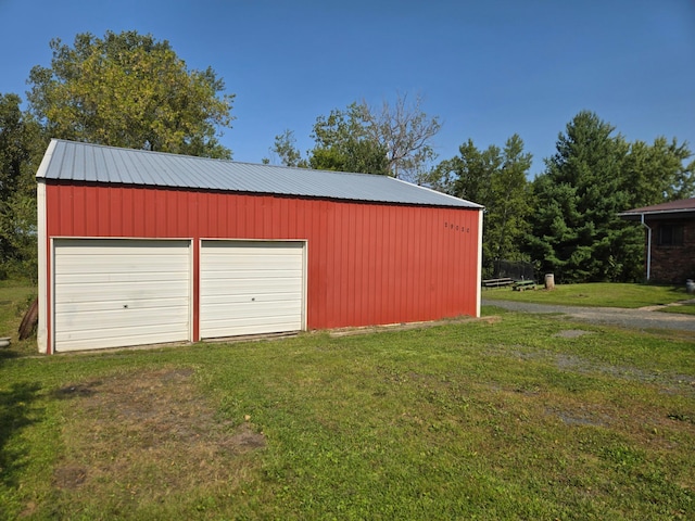 garage with a lawn