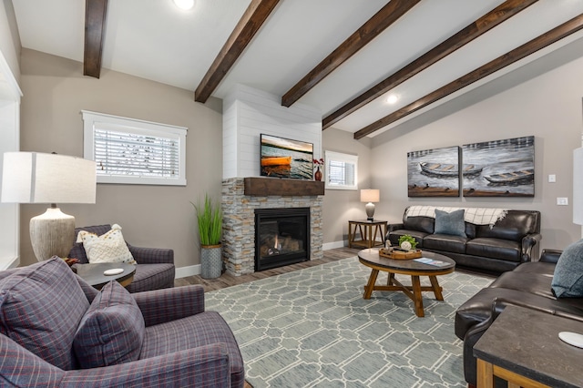 living room with lofted ceiling with beams, hardwood / wood-style flooring, and a fireplace