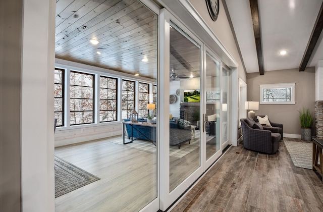 interior space featuring hardwood / wood-style flooring, beam ceiling, and wooden ceiling