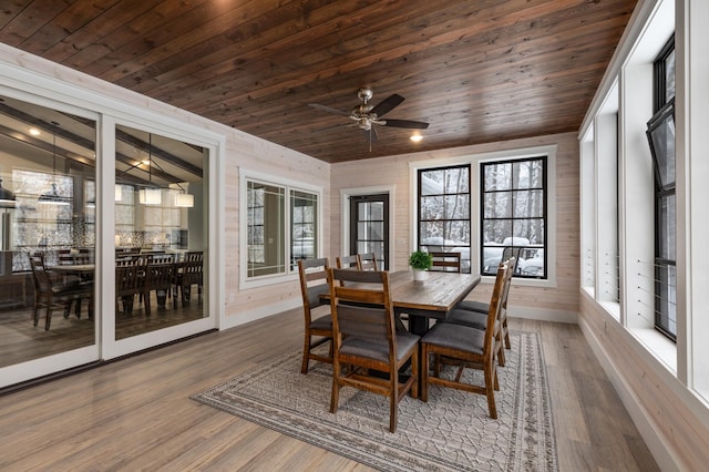 sunroom / solarium with wooden ceiling and ceiling fan