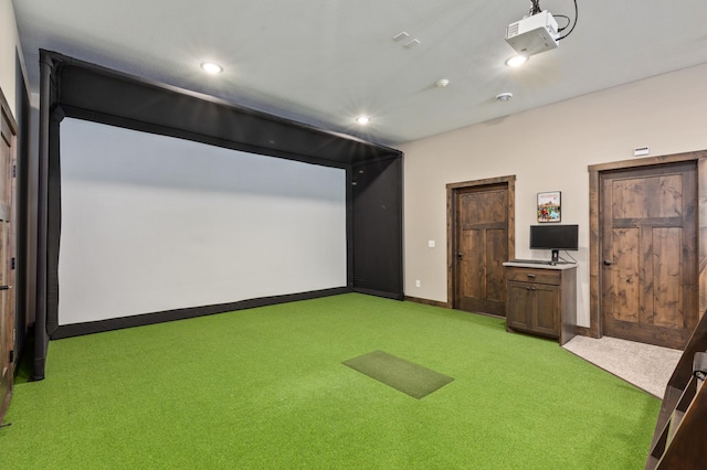 game room with golf simulator and light carpet