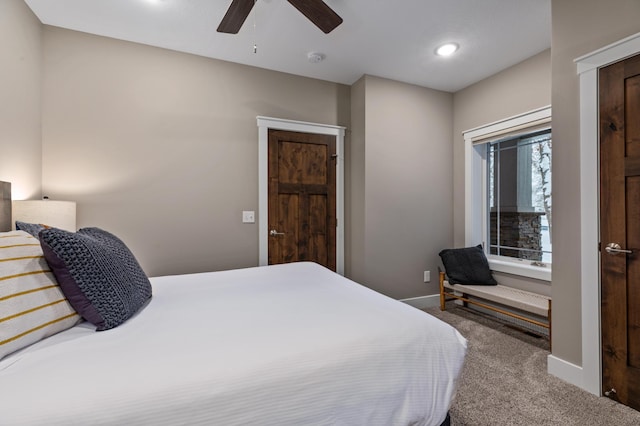 carpeted bedroom with ceiling fan