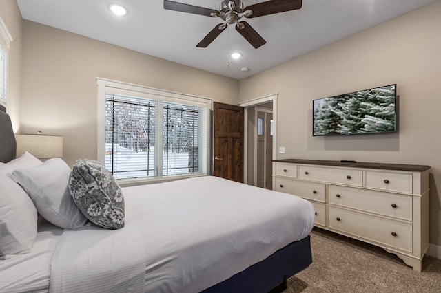 bedroom with ceiling fan and carpet