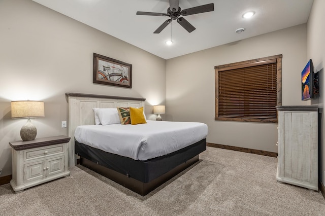 bedroom with light colored carpet and ceiling fan