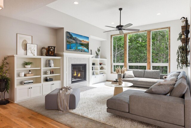 living room with hardwood / wood-style floors and ceiling fan