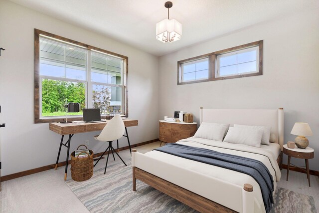 bedroom with a notable chandelier