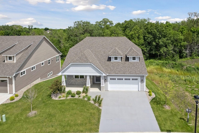 view of front of home featuring covered porch and a front yard