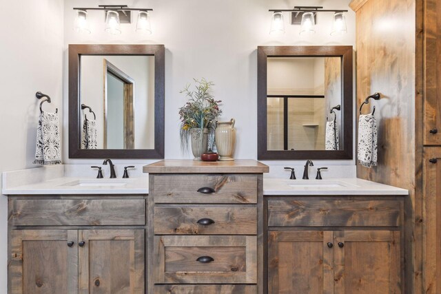 bathroom featuring vanity and an enclosed shower