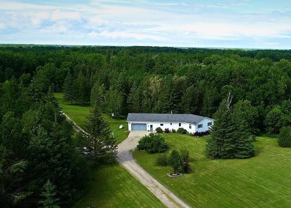 drone / aerial view with a forest view