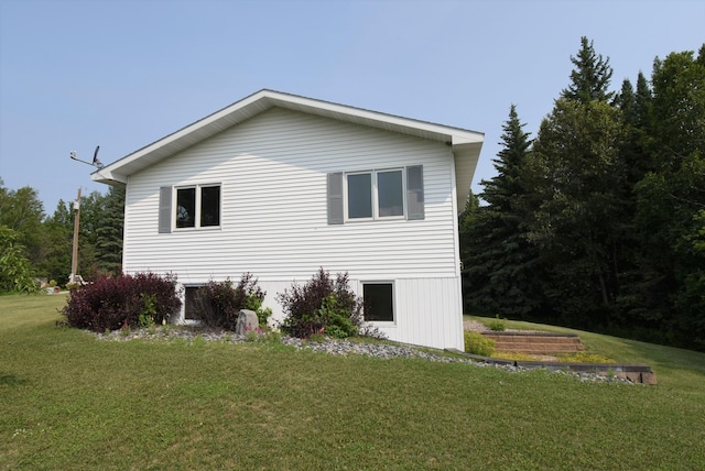 view of side of property featuring a yard