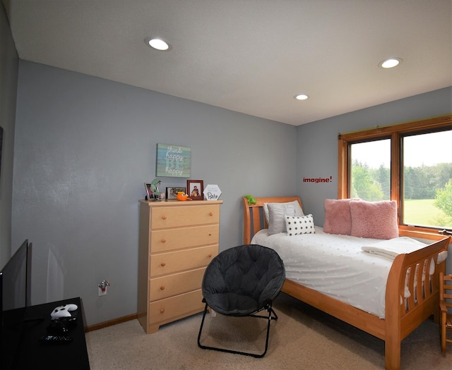bedroom featuring baseboards, light carpet, and recessed lighting
