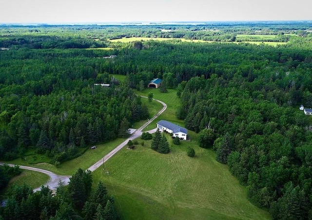 bird's eye view with a rural view and a wooded view