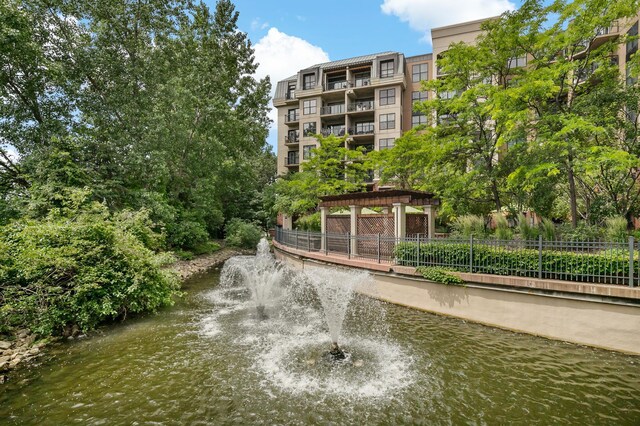 view of home's community with a water view