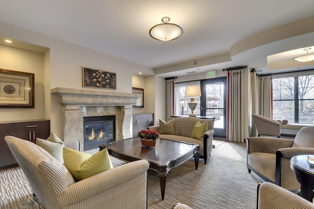 living room with light colored carpet and a premium fireplace