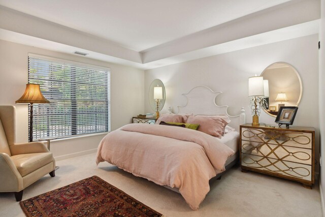 bedroom featuring light colored carpet