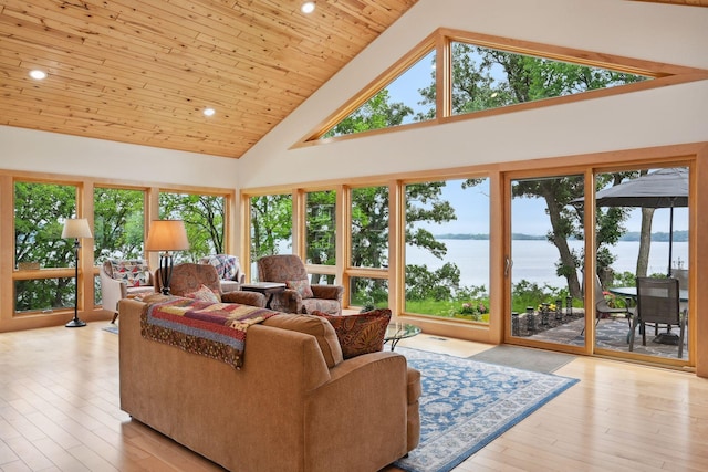 living room featuring light wood-type flooring, wood ceiling, a water view, and high vaulted ceiling