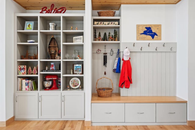 mudroom with light wood-type flooring and wood ceiling