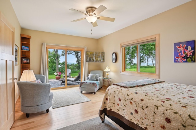 bedroom featuring access to outside, ceiling fan, and light hardwood / wood-style floors