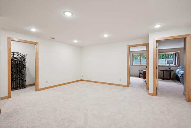 interior space featuring light carpet