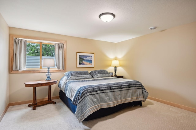 bedroom with light carpet