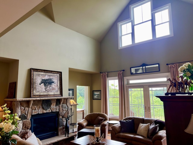 living room featuring french doors and a fireplace