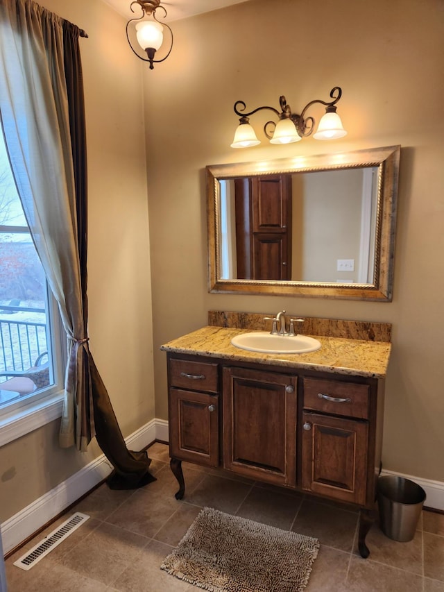 bathroom with vanity and tile patterned floors