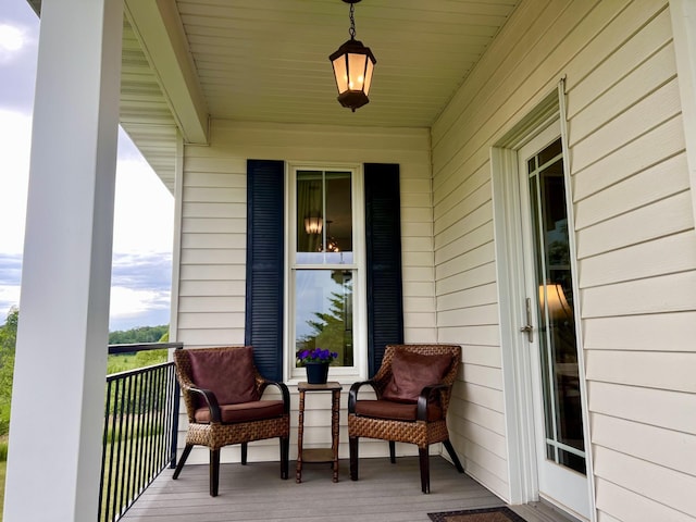 exterior space featuring covered porch and a sunroom