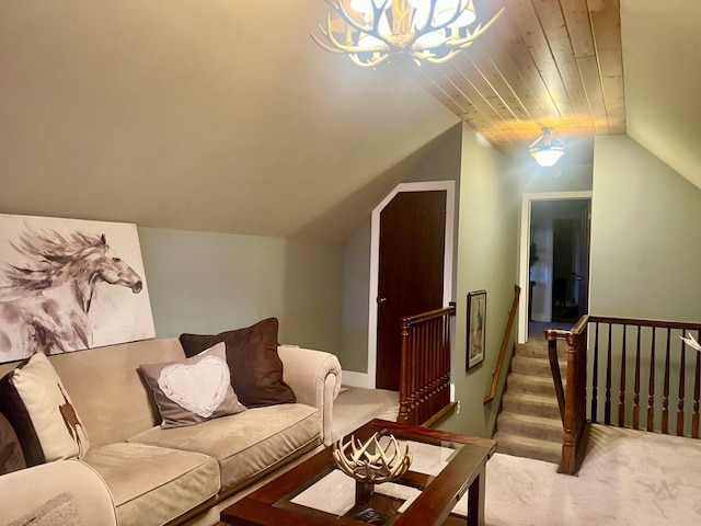 carpeted living room featuring lofted ceiling and an inviting chandelier