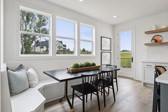 dining area featuring light wood-type flooring and breakfast area