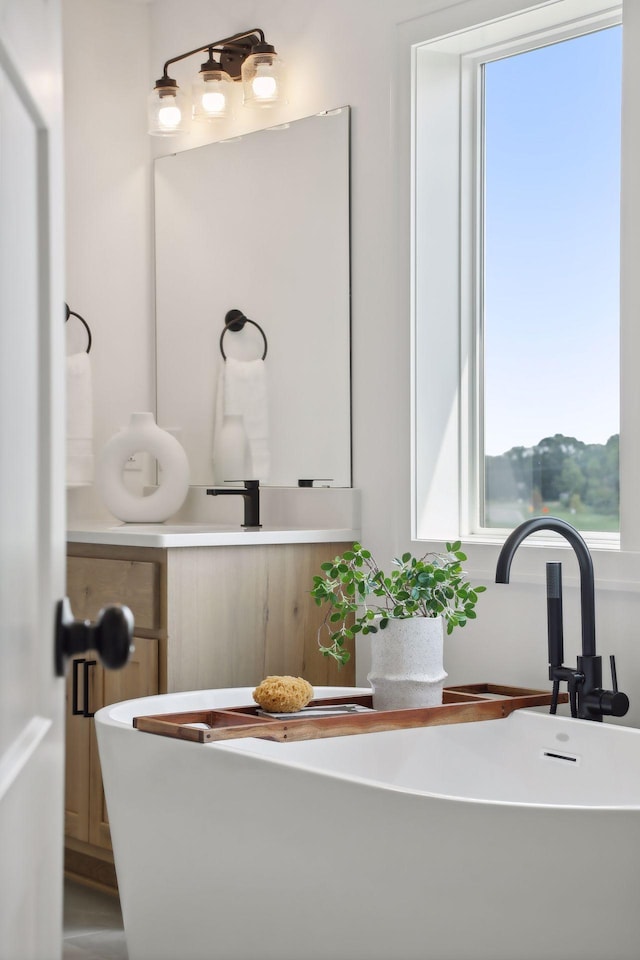 bathroom with a tub to relax in