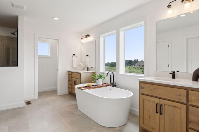 bathroom featuring a tub and vanity