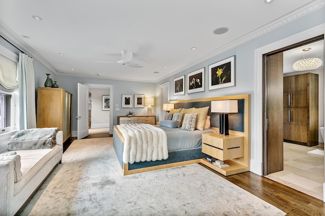 bedroom featuring wood-type flooring, ceiling fan, and crown molding