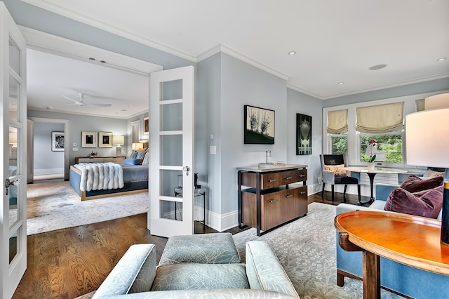 living room with dark wood-type flooring, ornamental molding, and french doors