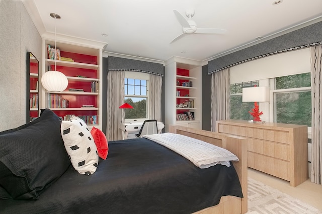 bedroom featuring crown molding, ceiling fan, and light colored carpet