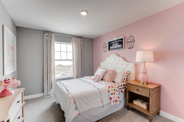 carpeted bedroom featuring a textured ceiling