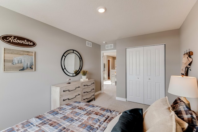 carpeted bedroom featuring a closet